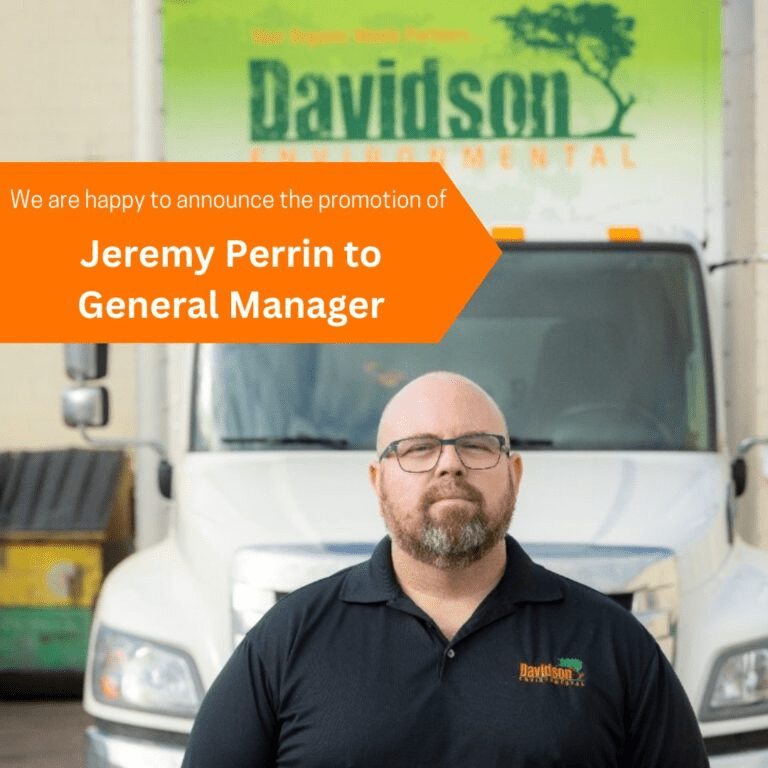 Jeremy Perrin is promoted to General Manager at Davidson Environmental, standing in front of company truck, emphasizing leadership change.
