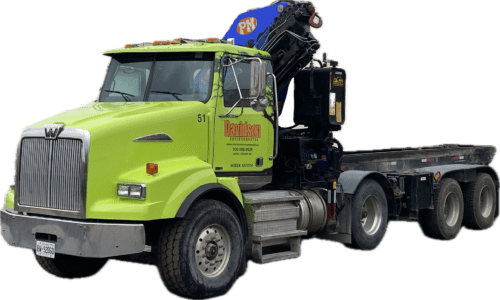 Bright green heavy-duty truck with a crane, labeled for a construction company. It showcases its capacity for transporting equipment and materials.