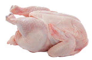 Raw whole chicken, plucked and cleaned, showcasing its natural shape. Relevant for recipes and discussions about poultry preparation and cooking methods.