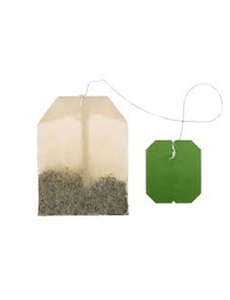 Two tea bags are displayed: one with a light-colored paper and filled with loose tea, the other green, indicating green tea.